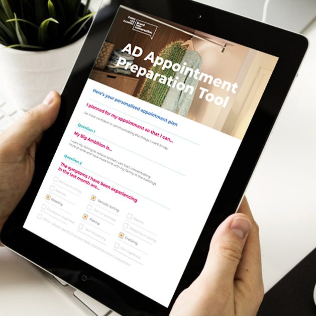 Close-up of a tablet being held by two hands with the Appointment Planner tool displayed on screen